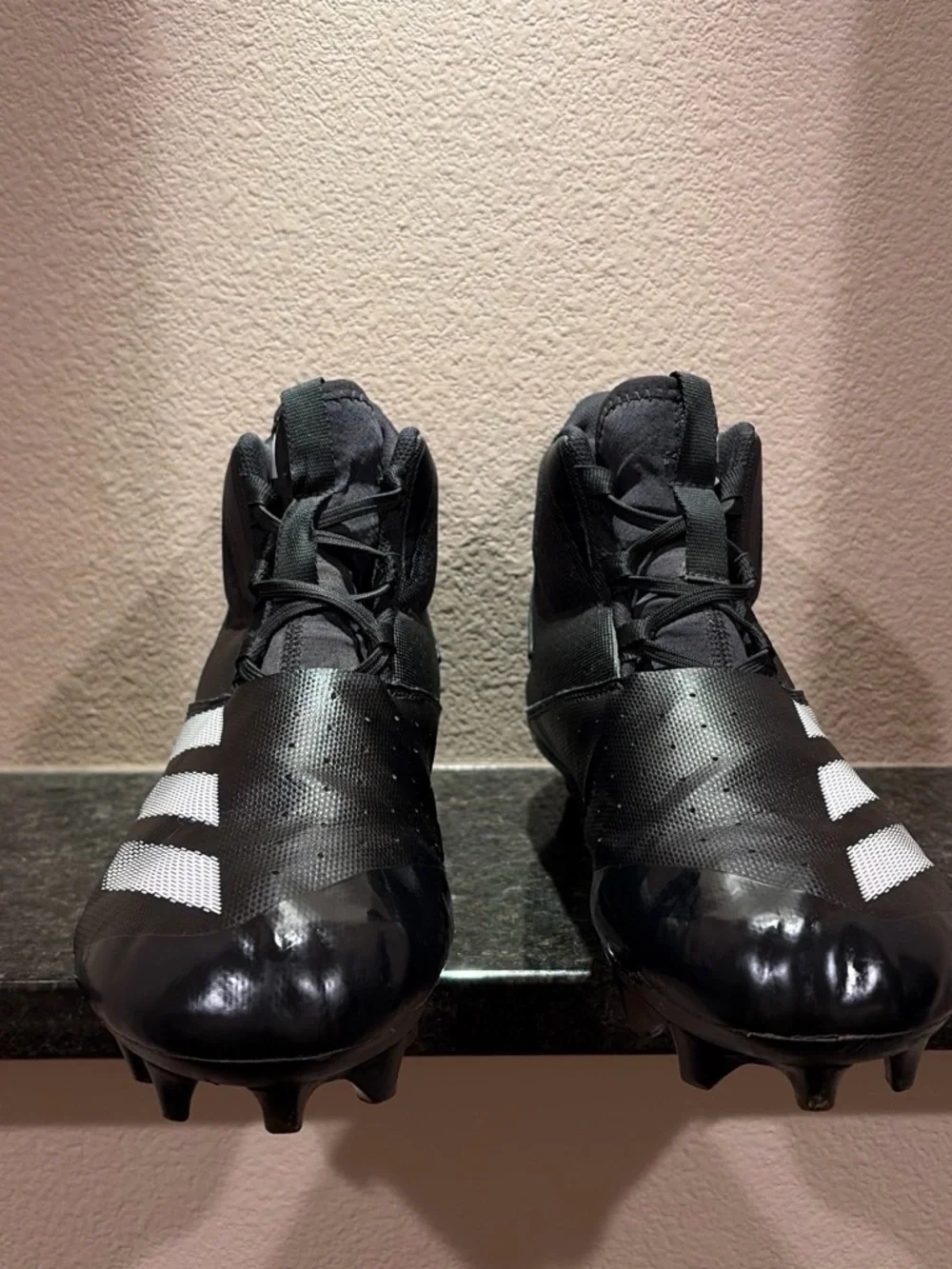 Black Mens Size 11 Football Cleats with White Stripes